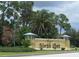 Sign for North Port, Florida with lush landscaping and trees at 5115 Foxhall Rd, North Port, FL 34288