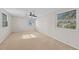 Light filled bedroom with neutral carpet, ceiling fan and windows with bright light at 5122 Marsh Field Rd # 62, Sarasota, FL 34235