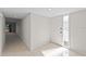 Hallway featuring ceramic tile and a frosted glass entry door with sidelight at 5122 Marsh Field Rd # 62, Sarasota, FL 34235