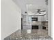 Galley style kitchen with gray cabinetry, gray backsplash and stainless steel appliances at 5122 Marsh Field Rd # 62, Sarasota, FL 34235