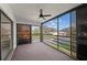 Enclosed lanai with a ceiling fan and views of the surrounding neighborhood at 5122 Marsh Field Rd # 62, Sarasota, FL 34235