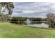 Lush greenery with a pond and a water fountain in the background at 5122 Marsh Field Rd # 62, Sarasota, FL 34235