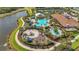 Aerial view of the community amenities including a large pool, clubhouse, and lush landscaping at 5388 Bartolomeo St, Sarasota, FL 34238