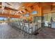 Spacious bar with overhead wood, pendant lighting, modern seating, and multiple TV screens, perfect for socializing at 5388 Bartolomeo St, Sarasota, FL 34238