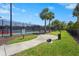 Community Bark Park featuring fenced in area, palm trees, and pet waste station at 5388 Bartolomeo St, Sarasota, FL 34238