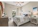 Relaxing bedroom featuring a cozy bed with patterned bedding and seaside inspired decor at 5388 Bartolomeo St, Sarasota, FL 34238