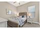 Comfortable bedroom featuring a queen-size bed, and side tables with lamps at 5388 Bartolomeo St, Sarasota, FL 34238
