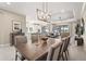Dining room area open to kitchen and living room, with a wooden dining table at 5388 Bartolomeo St, Sarasota, FL 34238