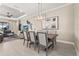Dining room area open to living area, with views of backyard at 5388 Bartolomeo St, Sarasota, FL 34238