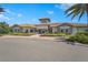 Beautiful community clubhouse with lush landscaping and ample parking at 5388 Bartolomeo St, Sarasota, FL 34238