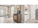 Open-concept view of the home's entry and kitchen with a hall tree as the focal point at 5388 Bartolomeo St, Sarasota, FL 34238