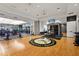 Spacious gym equipped with weights, machines and flat screen TVs for entertainment during workout at 5388 Bartolomeo St, Sarasota, FL 34238