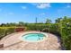 Relaxing community hot tub surrounded by lush landscaping at 5388 Bartolomeo St, Sarasota, FL 34238