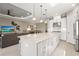 Spacious eat-in kitchen featuring granite countertops, stainless steel appliances, and an island with bar seating at 5388 Bartolomeo St, Sarasota, FL 34238