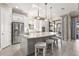 Modern eat-in kitchen featuring granite countertops, stainless steel appliances, and an island with bar seating at 5388 Bartolomeo St, Sarasota, FL 34238