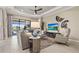 Comfortable living room featuring stylish decor and sliding glass doors to backyard at 5388 Bartolomeo St, Sarasota, FL 34238