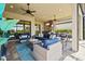 Cozy outdoor living space with comfortable seating, ideal for entertaining or relaxing at 5388 Bartolomeo St, Sarasota, FL 34238
