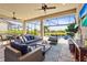 Stunning outdoor living space with a view of the pool and lush landscaping at 5388 Bartolomeo St, Sarasota, FL 34238