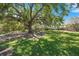Secluded park featuring a bench under a large tree with Spanish moss at 5388 Bartolomeo St, Sarasota, FL 34238