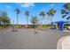 Bright playground with modern climbing structures, shade canopy, and safety-surfaced ground for recreational activities at 5388 Bartolomeo St, Sarasota, FL 34238