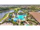 Community resort style pool with outdoor bar area and surrounding seating at 5388 Bartolomeo St, Sarasota, FL 34238