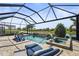 Beautiful pool and spa with waterfall features and relaxing lounge chairs, perfect for enjoying sunny days at 5388 Bartolomeo St, Sarasota, FL 34238