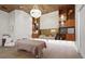 Calming treatment room with modern lighting, wood accents, and a comfortable massage table at 5388 Bartolomeo St, Sarasota, FL 34238