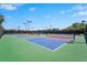 Wide shot of community tennis courts featuring multiple courts with a gazebo at 5388 Bartolomeo St, Sarasota, FL 34238