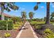 Brick paved community walking path lined with vibrant landscaping at 5388 Bartolomeo St, Sarasota, FL 34238