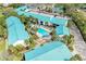 An aerial shot of condos with a community pool and manicured landscaping at 5631 Midnight Pass Rd # 1007, Sarasota, FL 34242