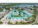 Aerial view of a condo community with a pool, surrounded by waterways and lush landscaping at 5631 Midnight Pass Rd # 1007, Sarasota, FL 34242