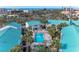 Expansive aerial view of the residential buildings, community pool, and waterfront location at 5631 Midnight Pass Rd # 1007, Sarasota, FL 34242