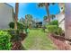 Inviting common area with lush landscaping and seating at 5631 Midnight Pass Rd # 1007, Sarasota, FL 34242
