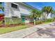 Office area with well-maintained landscaping, vibrant plants, and a welcoming entrance at 5631 Midnight Pass Rd # 1007, Sarasota, FL 34242