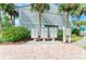 Exterior view of building with rows of mailboxes and tropical landscaping at 5631 Midnight Pass Rd # 1007, Sarasota, FL 34242
