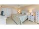 Serene main bedroom features a ceiling fan, tile floors, and closet space, creating a restful retreat at 5631 Midnight Pass Rd # 1007, Sarasota, FL 34242