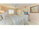 Bright main bedroom features a ceiling fan and large dresser at 5631 Midnight Pass Rd # 1007, Sarasota, FL 34242