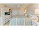 Spacious main bedroom featuring neutral tones, ceiling fan, and closet doors at 5631 Midnight Pass Rd # 1007, Sarasota, FL 34242