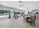 The community clubhouse with an open kitchen and dining area is perfect for gathering with friends and Gathering at 565 Sutton Place, Longboat Key, FL 34228