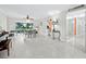 Bright, open-plan living space with neutral paint, tile floors, and natural lighting at 565 Sutton Place, Longboat Key, FL 34228