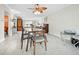 Bright living space featuring tile floors, a dining area, a piano, and comfortable seating at 565 Sutton Place, Longboat Key, FL 34228
