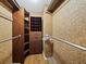 Walk-in closet featuring custom built-in storage solutions at 565 Sutton Place, Longboat Key, FL 34228