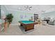 Inviting game room features a pool table, comfortable seating, and stylish decor for relaxation and entertainment at 565 Sutton Place, Longboat Key, FL 34228