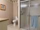Bathroom featuring a toilet, shower with glass door, and vanity with counter space at 5657 Westwind Ln, Sarasota, FL 34231