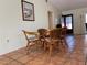 Dining area with a glass table and 4 chairs and neutral colored walls at 5657 Westwind Ln, Sarasota, FL 34231