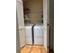 Convenient laundry closet with side-by-side washer and dryer units at 5657 Westwind Ln, Sarasota, FL 34231