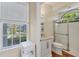 Bright bathroom featuring a shower, toilet, and a vanity at 6620 Saint James Xing, University Park, FL 34201