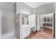 Bathroom with shower, vanity, tile flooring, and a bedroom doorway at 6620 Saint James Xing, University Park, FL 34201