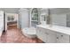 Spacious bathroom with tile flooring, garden tub, and view to the bedroom at 6620 Saint James Xing, University Park, FL 34201