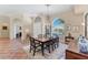 Elegant dining room with tile flooring, large windows, chandelier, and dining set with seating for six at 6620 Saint James Xing, University Park, FL 34201
